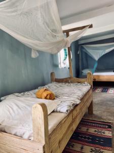 Un ou plusieurs lits dans un hébergement de l'établissement Mawingu lodge
