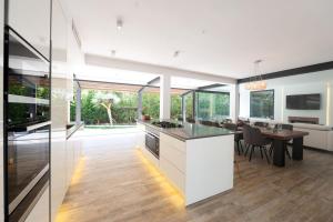 a kitchen and dining room with a dining table at Casa Guindilla in Portals Nous