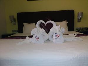 Voodi või voodid majutusasutuse Mirage Hotel Al Aqah toas