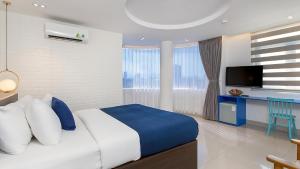 Postel nebo postele na pokoji v ubytování Lucia Beach Hotel