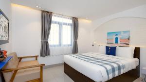 Postel nebo postele na pokoji v ubytování Lucia Beach Hotel