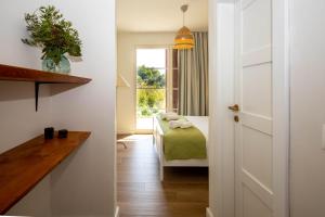 a small room with a bed and a window at Santa Lucia - Villa&Boat in Turanj