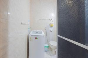 a small bathroom with a toilet and a sink at Copacabana Beachside Retreat in Rio de Janeiro +22 photos