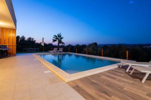 a swimming pool in the middle of a house at Santa Lucia - Villa&Boat in Turanj