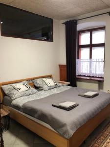 Posteľ alebo postele v izbe v ubytovaní Apartman U Andela
