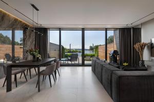 a dining room with a table and chairs at GABA villas in Vyshhorod
