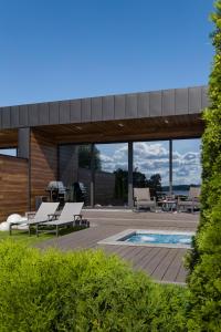 a house with a swimming pool and a patio at GABA villas in Vyshhorod