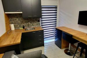 a kitchen with a sink and a counter top at Anastasia studio serres in Serres +7 photos