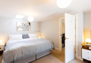 a bedroom with a large bed in a room at London House, a stylish family home for 6. in Newport Pembrokeshire