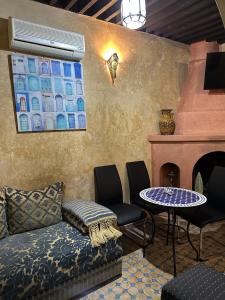 a living room with a couch and a table at Dar Bargach in Tangier