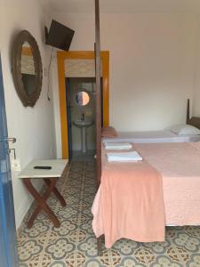 Postel nebo postele na pokoji v ubytování Suítes Casa da Colônia