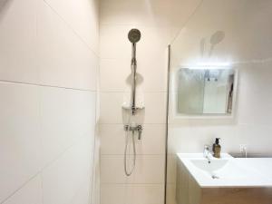 a bathroom with a shower and a sink at Suite Onyx in Lyon