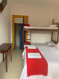 Postel nebo postele na pokoji v ubytování Suítes Casa da Colônia