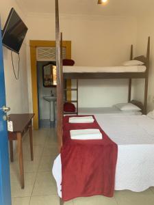 Postel nebo postele na pokoji v ubytování Suítes Casa da Colônia
