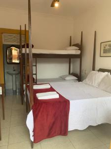 Postel nebo postele na pokoji v ubytování Suítes Casa da Colônia