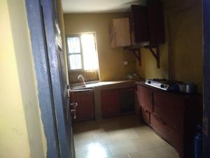 a small kitchen with a sink and a window at Two bedroom Home at Gbagi, New Ife Road, Ibadan @ Igbekele Oluwa House, 3 Zone A, Opeyemi Street, New Gbagi Market, New Ife Road, Gbagi, Ibadan, Oyo State in Ibadan