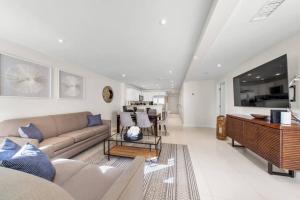 a living room with a couch and a table at Amazing BahiaMar beachfront 2 steps from amenities in South Padre Island