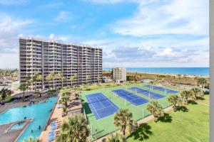 an aerial view of a resort with tennis courts and the ocean at Amazing 7th floor beachfront condo wonderful views in South Padre Island