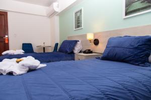Postel nebo postele na pokoji v ubytování Hotel San Blas