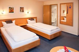 Postel nebo postele na pokoji v ubytování Hotel bei Liebe's