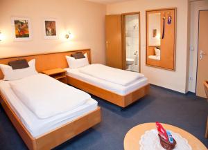 Postel nebo postele na pokoji v ubytování Hotel bei Liebe's
