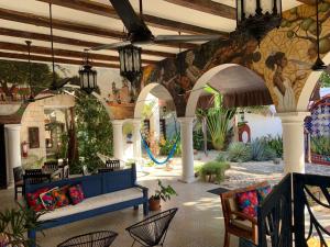 a living room with a blue couch in the middle at Real Haciendas in Valladolid