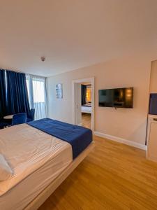 Postel nebo postele na pokoji v ubytování Batumi floor40