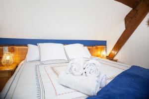 Postel nebo postele na pokoji v ubytování Le Sarcinoé