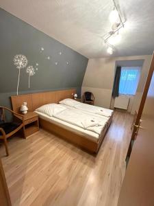 a bedroom with a large bed in a room at Hotel Alte Apotheke in Bad Dürrenberg