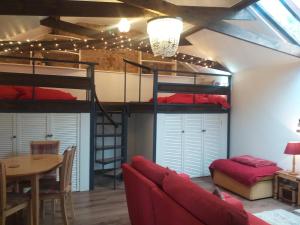 a room with two bunk beds and a table at The Little House in Hull in Hull