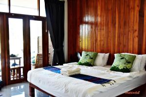Voodi või voodid majutusasutuse Nan View Farmer Resort toas