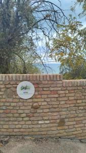 a brick wall with a sign on top of it at DaVi' casa vacanze. Un sogno immerso nel verde ! in Montepagano