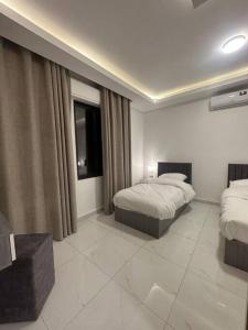 Ένα ή περισσότερα κρεβάτια σε δωμάτιο στο cozy home near all services (19)