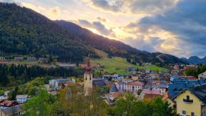 a small town in a valley with a mountain at Wald Haus Tarvisio in Tarvisio