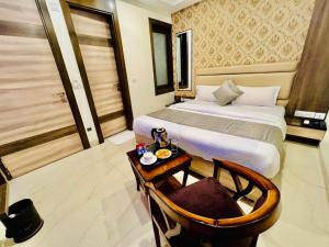 Ένα ή περισσότερα κρεβάτια σε δωμάτιο στο Hotel Apple Inn & Suites, New Delhi