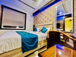 Ένα ή περισσότερα κρεβάτια σε δωμάτιο στο Hotel Apple Inn & Suites, New Delhi