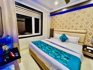 Ένα ή περισσότερα κρεβάτια σε δωμάτιο στο Hotel Apple Inn & Suites, New Delhi