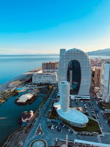 an aerial view of a large building next to the ocean at Orbi floor40 in Batumi