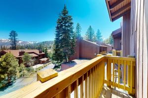 a wooden balcony with a view of a mountain at Mammoth Ski & Racquet Club #131 in Mammoth Lakes
