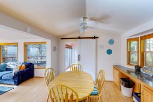 a kitchen and dining room with a table and chairs at Bait Shop in Carpenterville