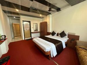 Krevet ili kreveti u jedinici u objektu Hotel Dhruv Palace