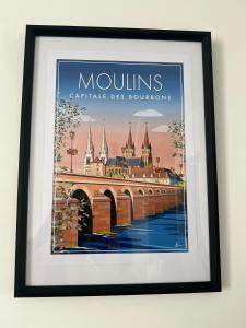 a framed picture of a painting of a bridge at Le Cocon Moulinois, proche gare avec services by PRIMO C0NCIERGERIE in Moulins