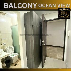 a bathroom with a shower stall and a toilet at Near US Embassy - Free Sauna & Pool Access + 20% Off Promo This Month! Explore Deluxe Studio Unit in Manila w/ Balcony Perfectly Situated Near NAIA Airport, Heart of Manila - Updated 2023 Price for Your Unforgettable Ultimate Staycation Experience! in Manila
