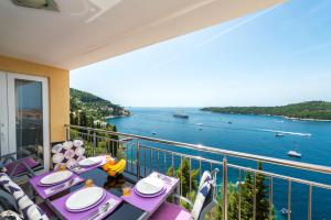 a balcony with a view of the water at Apartments Lavander & Violet in Dubrovnik