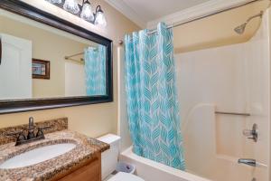 a bathroom with a sink and a shower at Beachfront Murrells Inlet Home - Walk to Pier! in Myrtle Beach +35 photos