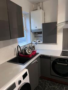 a kitchen with a sink and a counter top at 36 Park Road Lenton in Nottingham