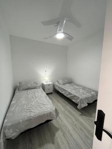 A bed or beds in a room at Ataraxia Casa Vacacional