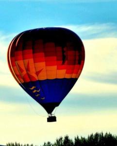 a colorful hot air balloon flying in the sky at Emily's Escape AC Smart TV and Covered Parking in Snohomish