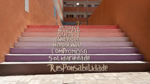 a set of stairs with words painted on them at 3 bdr cozy apt in Condominio Mi, Palmarejo Grande in Praia