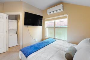 a bedroom with a large bed and a window at Greenway Hideaway in Fayetteville